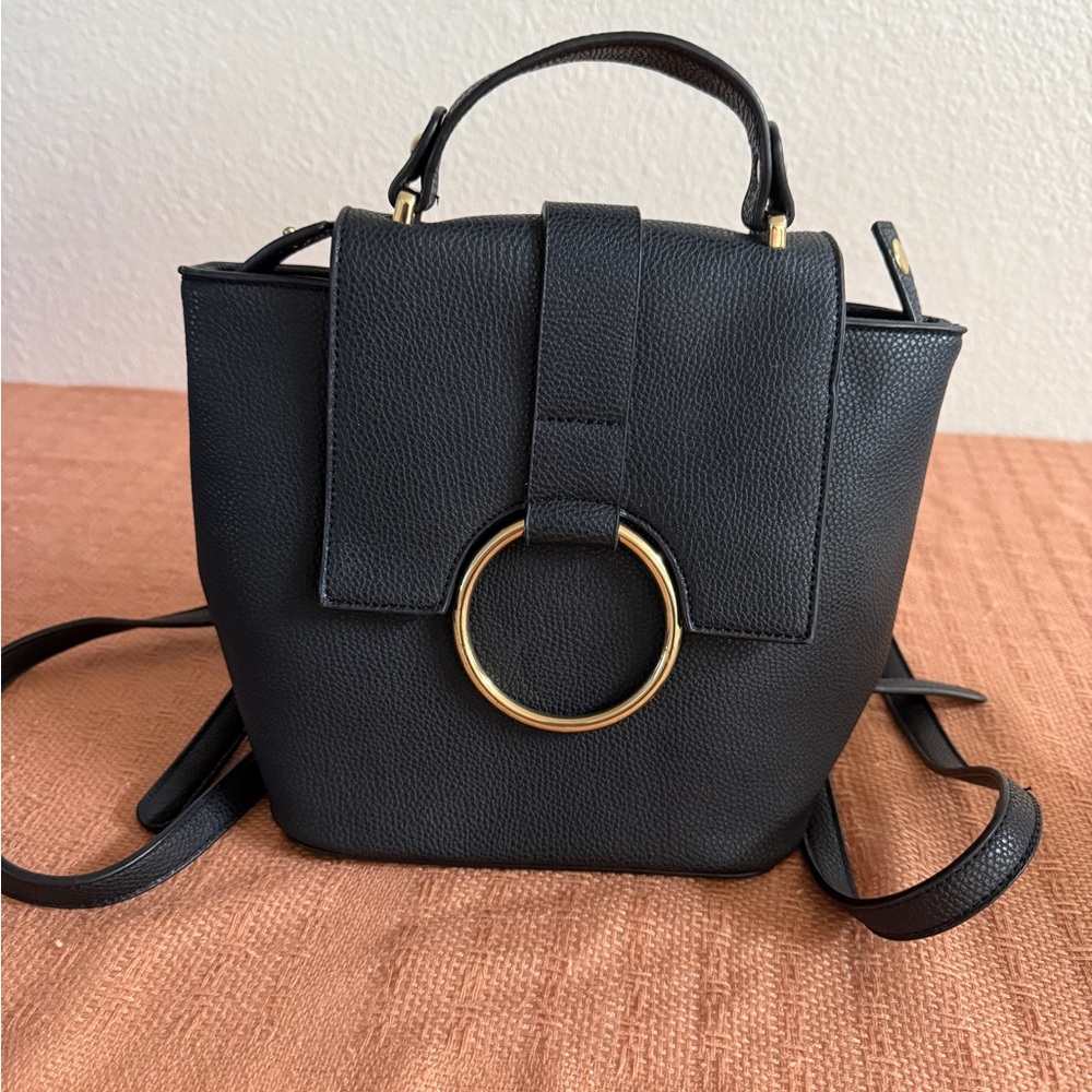 Elegant Black Leather Backpack Purse with Gold Accent